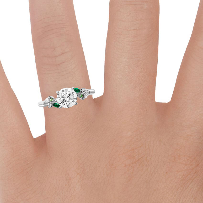 18K White Gold Arden Diamond Ring with Lab Emerald Accents, large zoomed in top view on a hand
