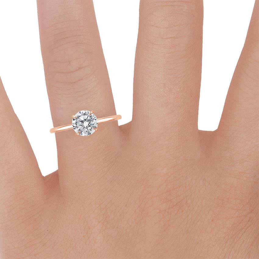 14K Rose Gold Secret Halo Diamond Ring, large zoomed in top view on a hand
