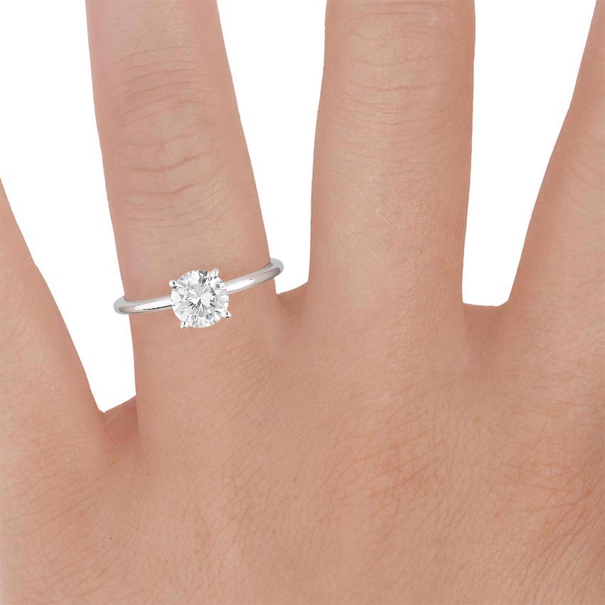 Platinum Four-Prong Petite Comfort Fit Ring, large zoomed in top view on a hand