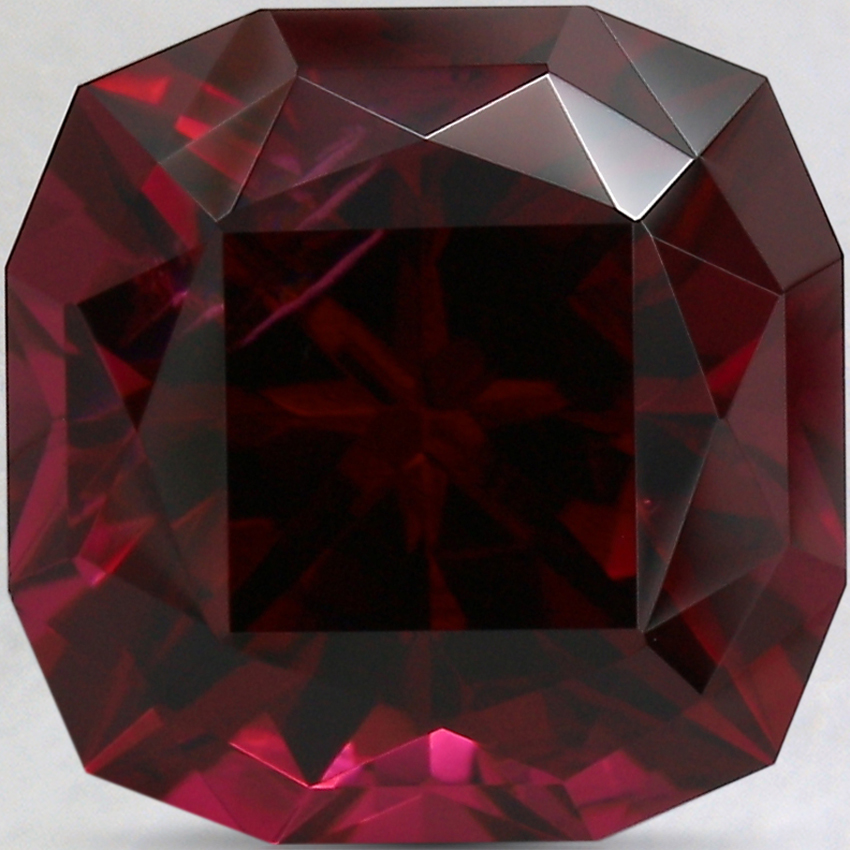 10.8mm Unheated Red Modified Cushion Rhodolite Garnet