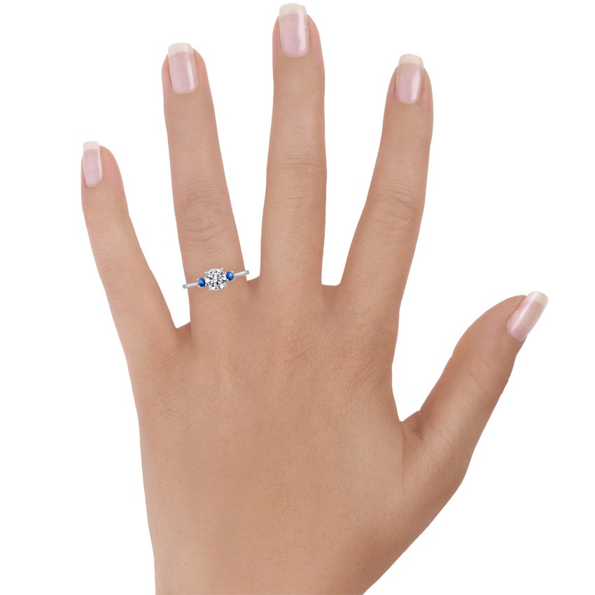18K White Gold Selene Ring with Sapphire Accents, large top view on a hand