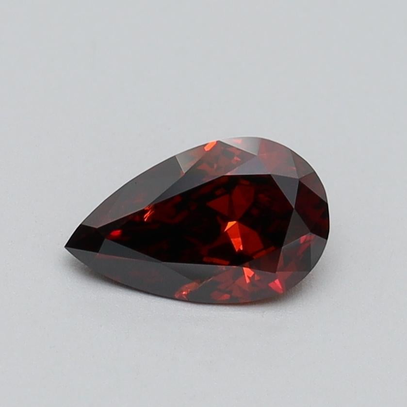 0.55 Ct. Fancy Vivid Brownish Orange Pear Lab Grown Diamond