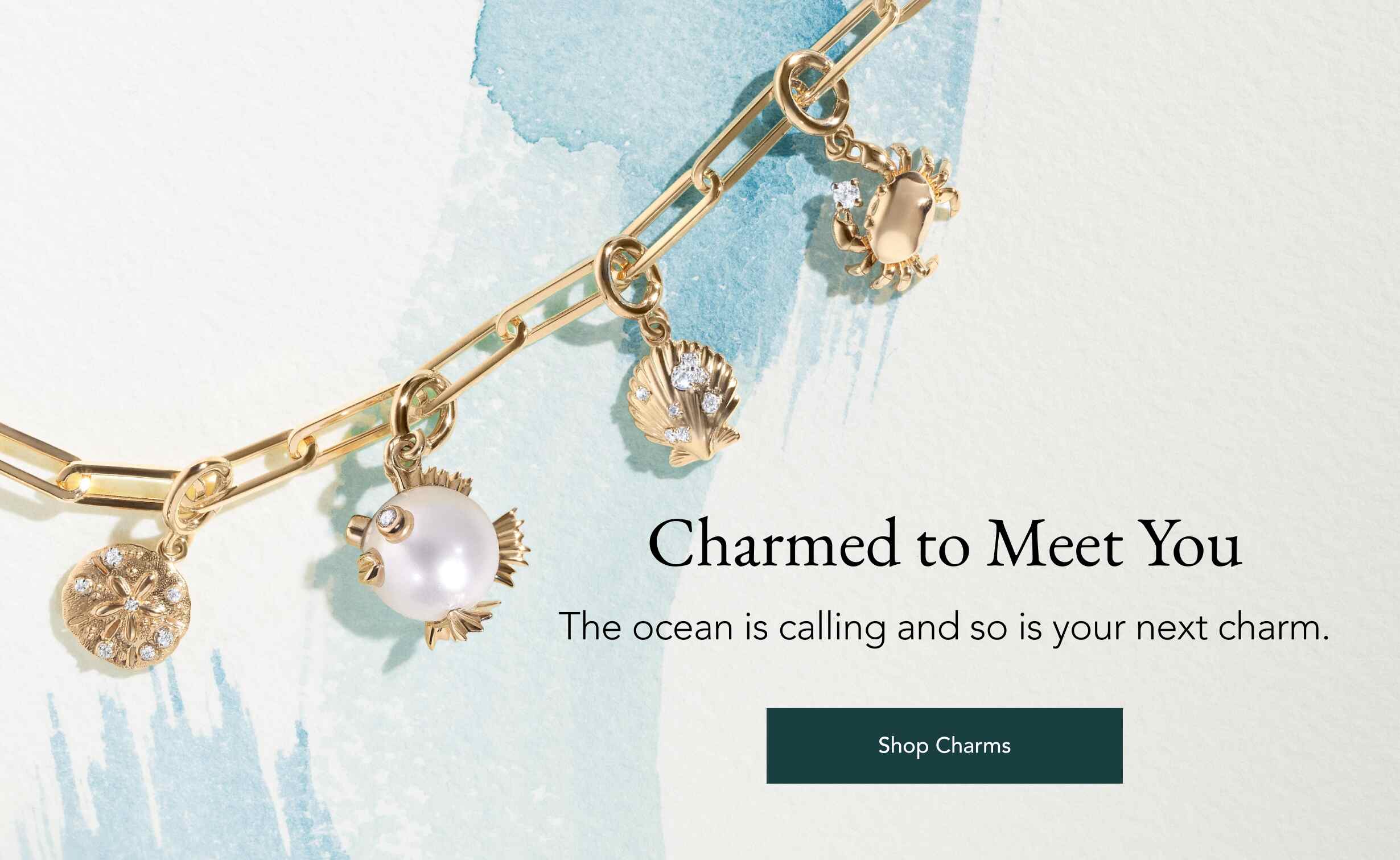 Assortment of gold Seaside charms.