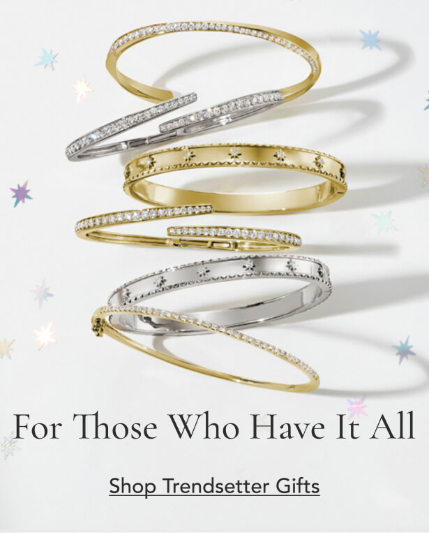Assortment of gold and silver diamond bangles.