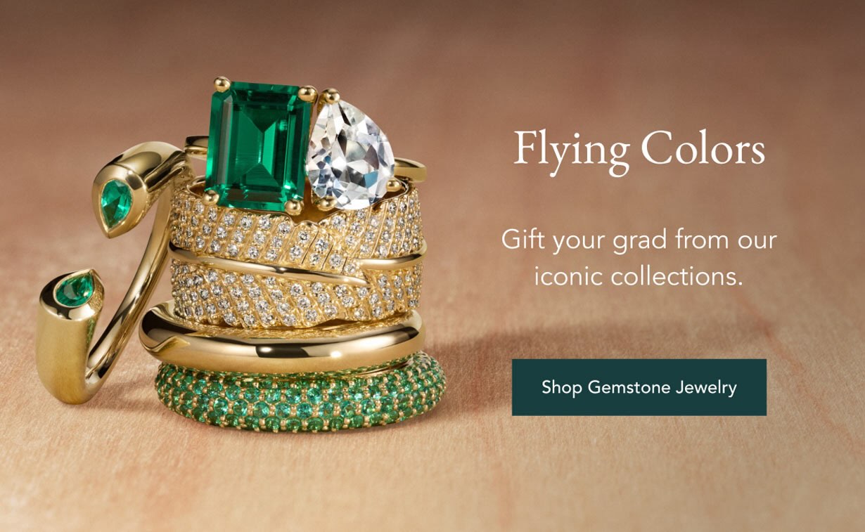 Stack of gemstone fashion rings.