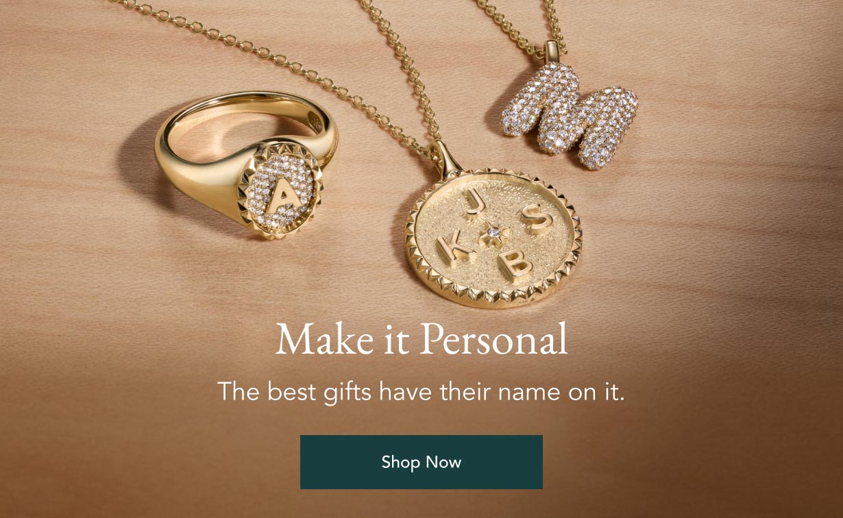 Personalized gold necklaces and signet ring.