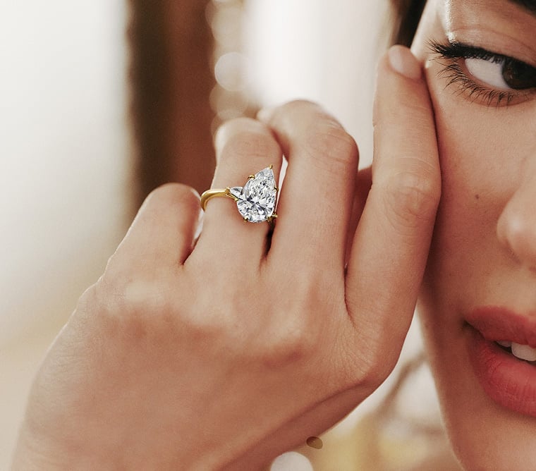 Model wearing a diamond engagement ring