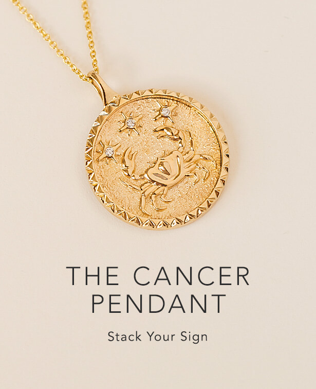 Gold cancer zodiac necklace.