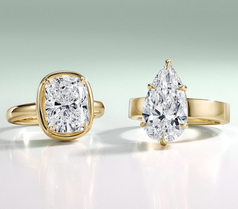 Two yellow gold engagement rings