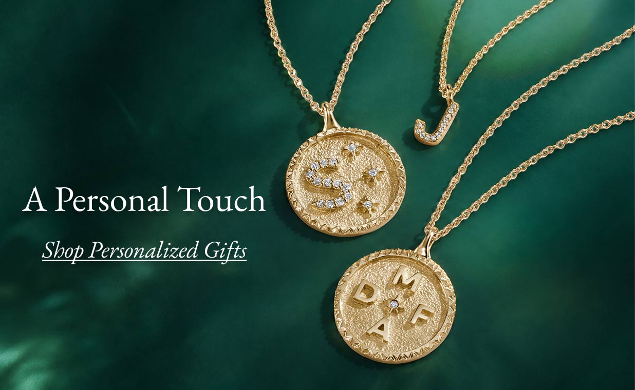Three personalized diamond necklaces.