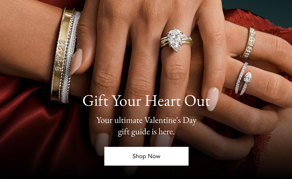 Model wearing assortment of diamond fine jewelry.