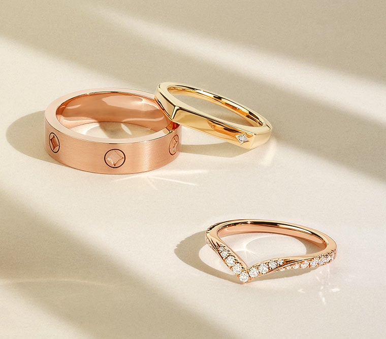 Rose gold and yellow gold wedding rings.