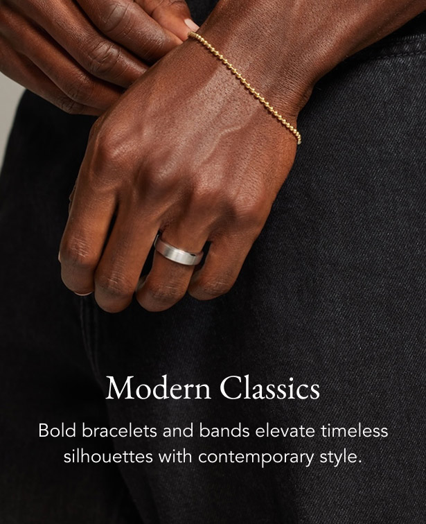 Model wearing gold chain and tennis bracelets.