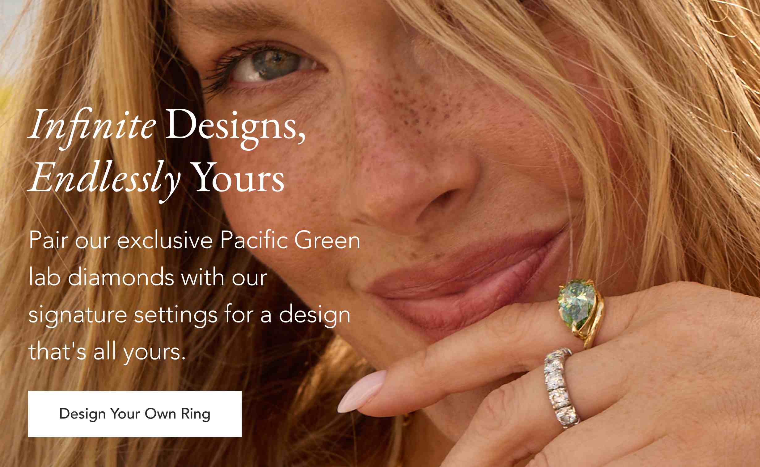 Person wearing a Pacific Green lab diamond ring and a diamond wedding band.