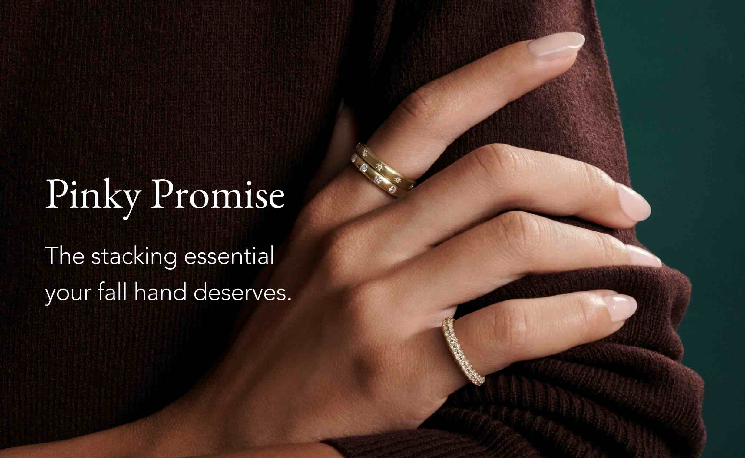 Model wearing a gold diamond pinky ring.
