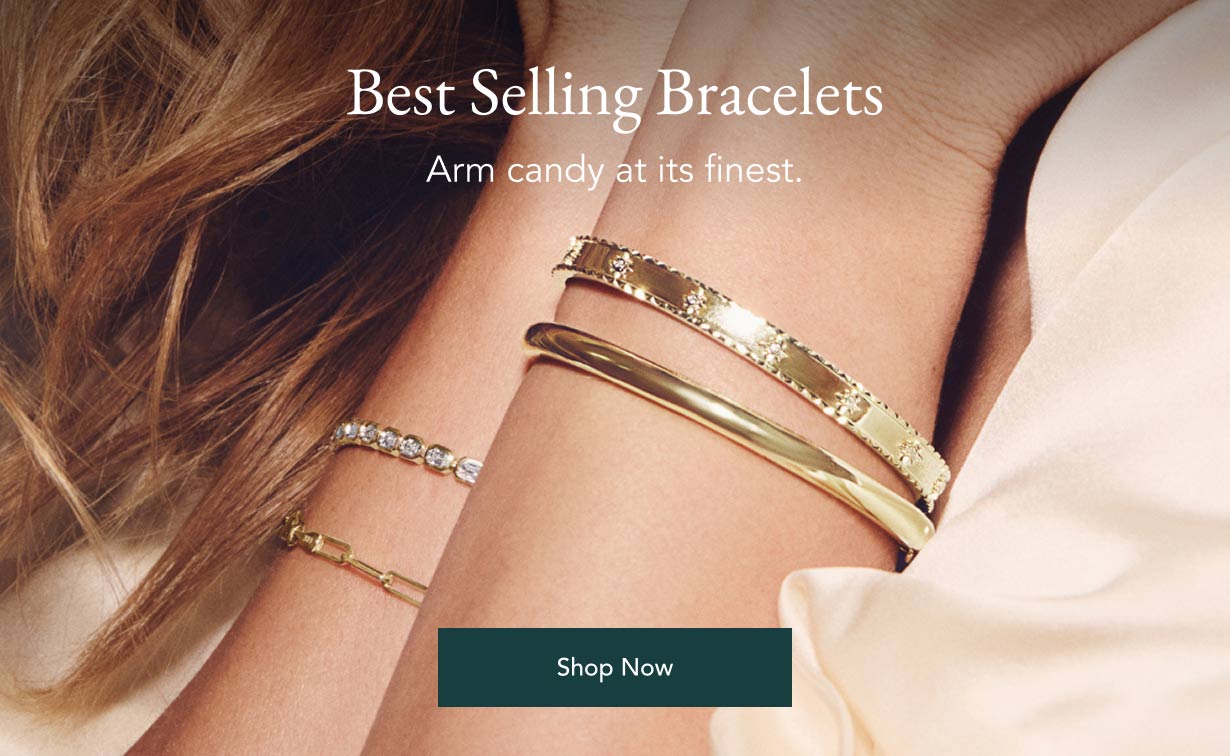 Model wearing assortment of best selling bracelets.