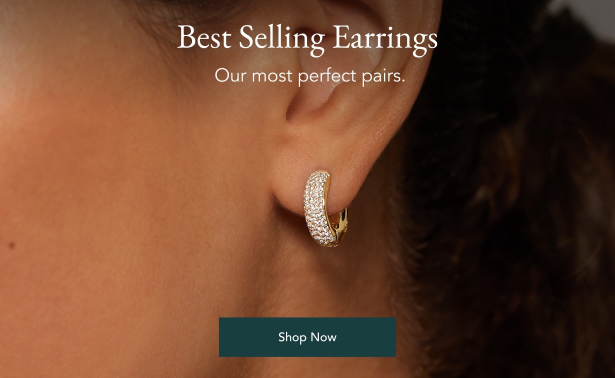Model wearing best selling diamond hoops.