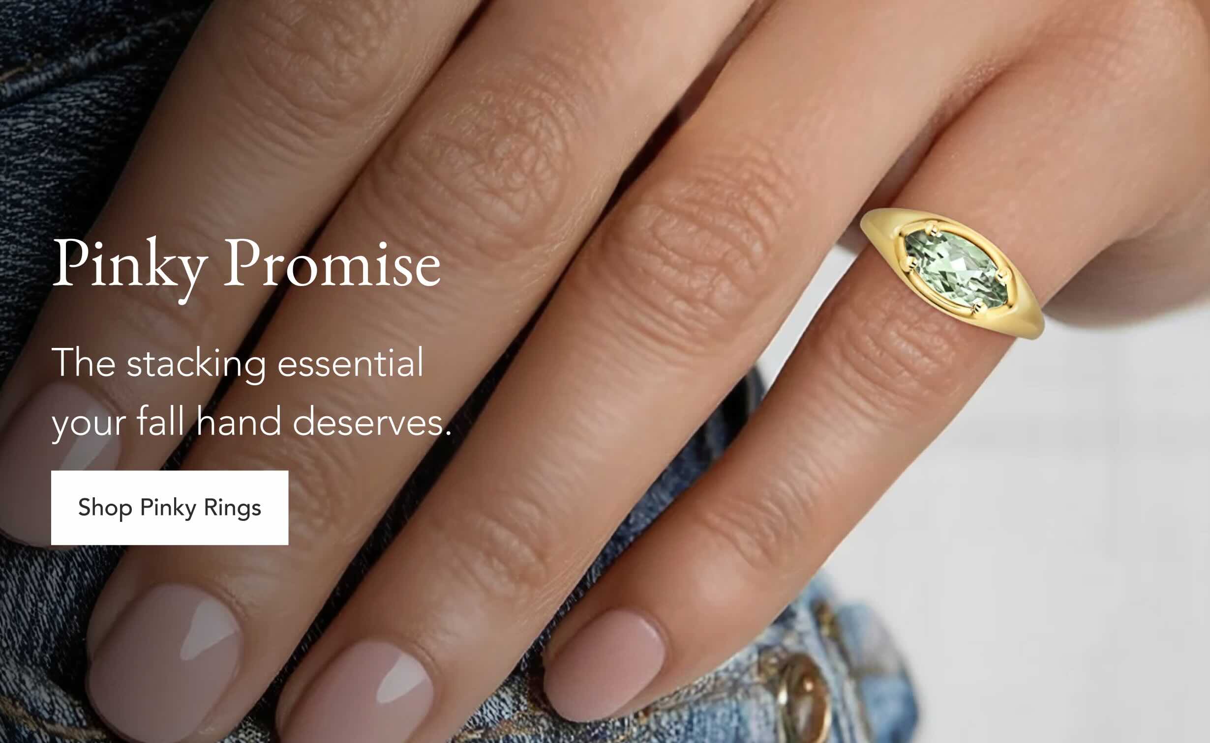 Model wearing a gemstone pinky ring.