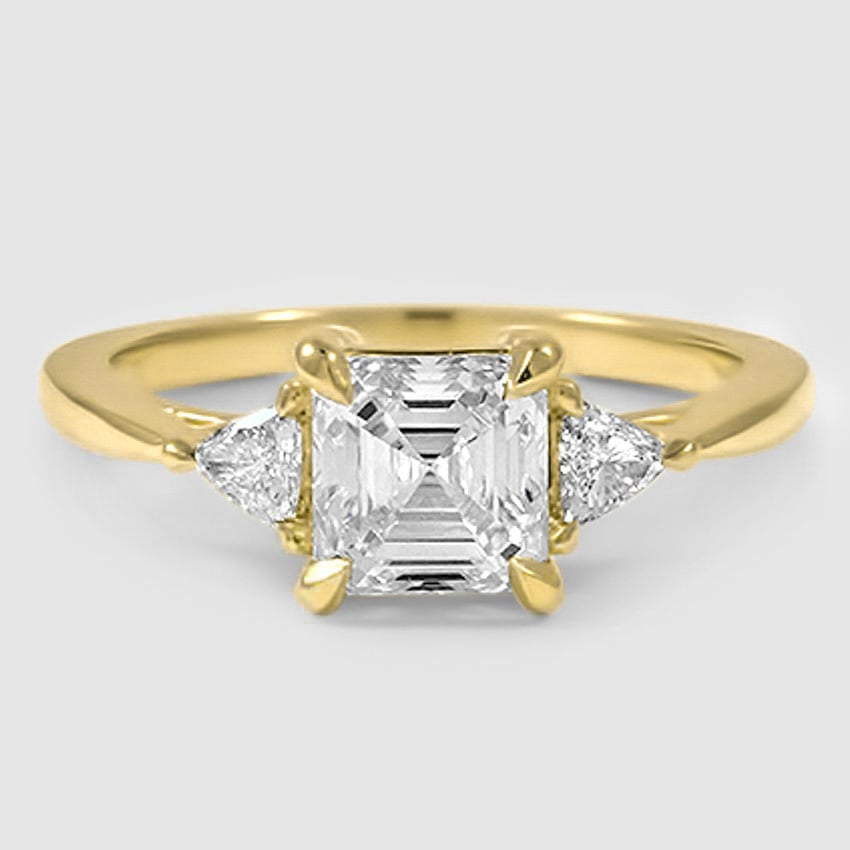 18K Yellow Gold trillion cut three stone 