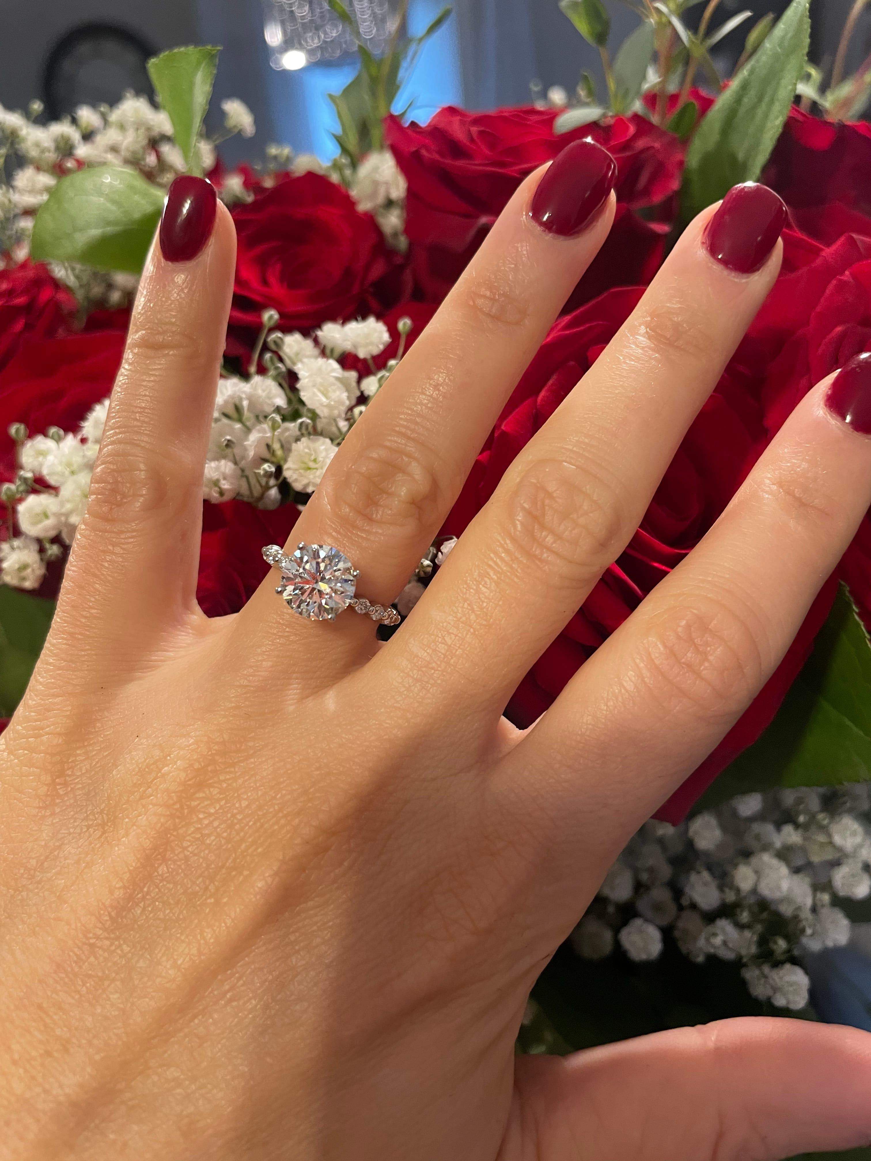 Oval diamond ring on hand