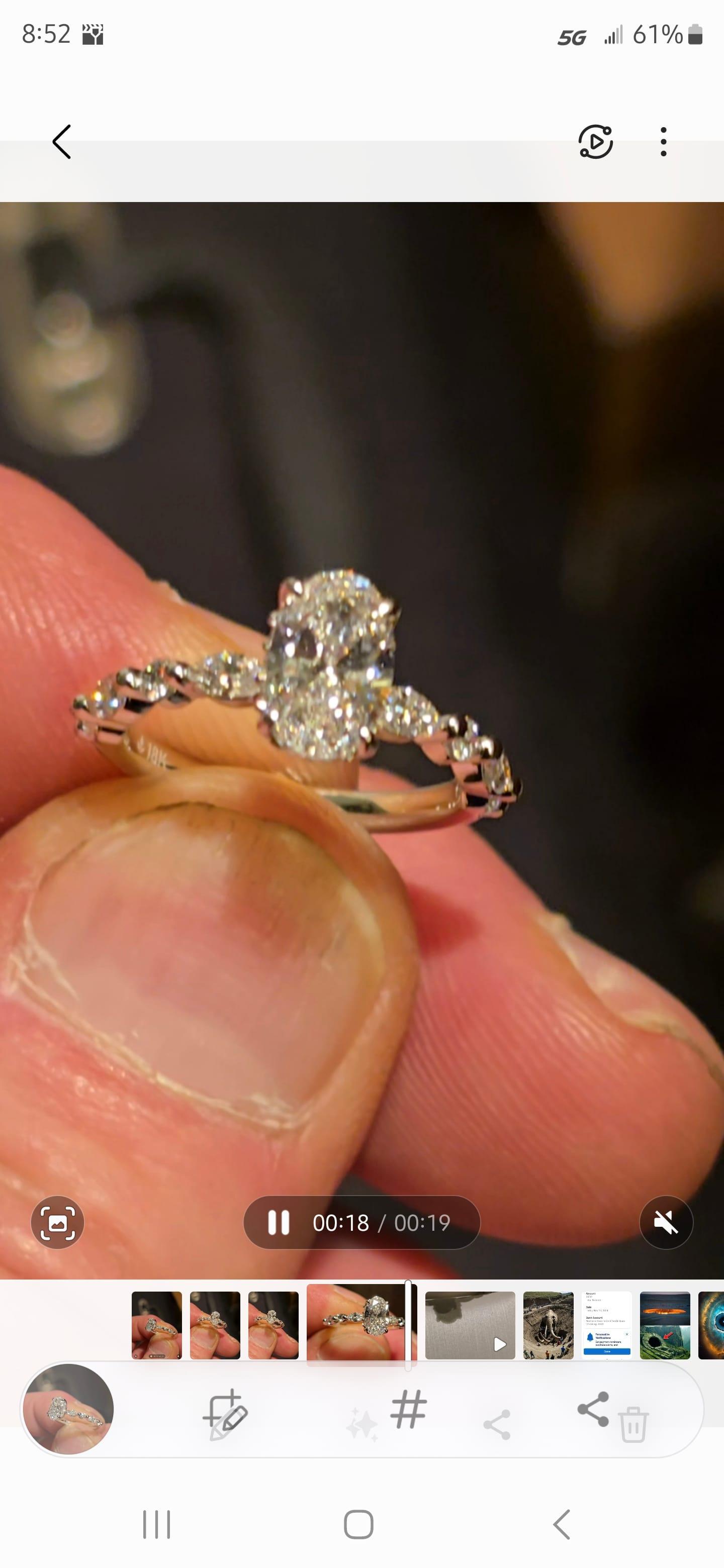 Oval diamond ring on hand