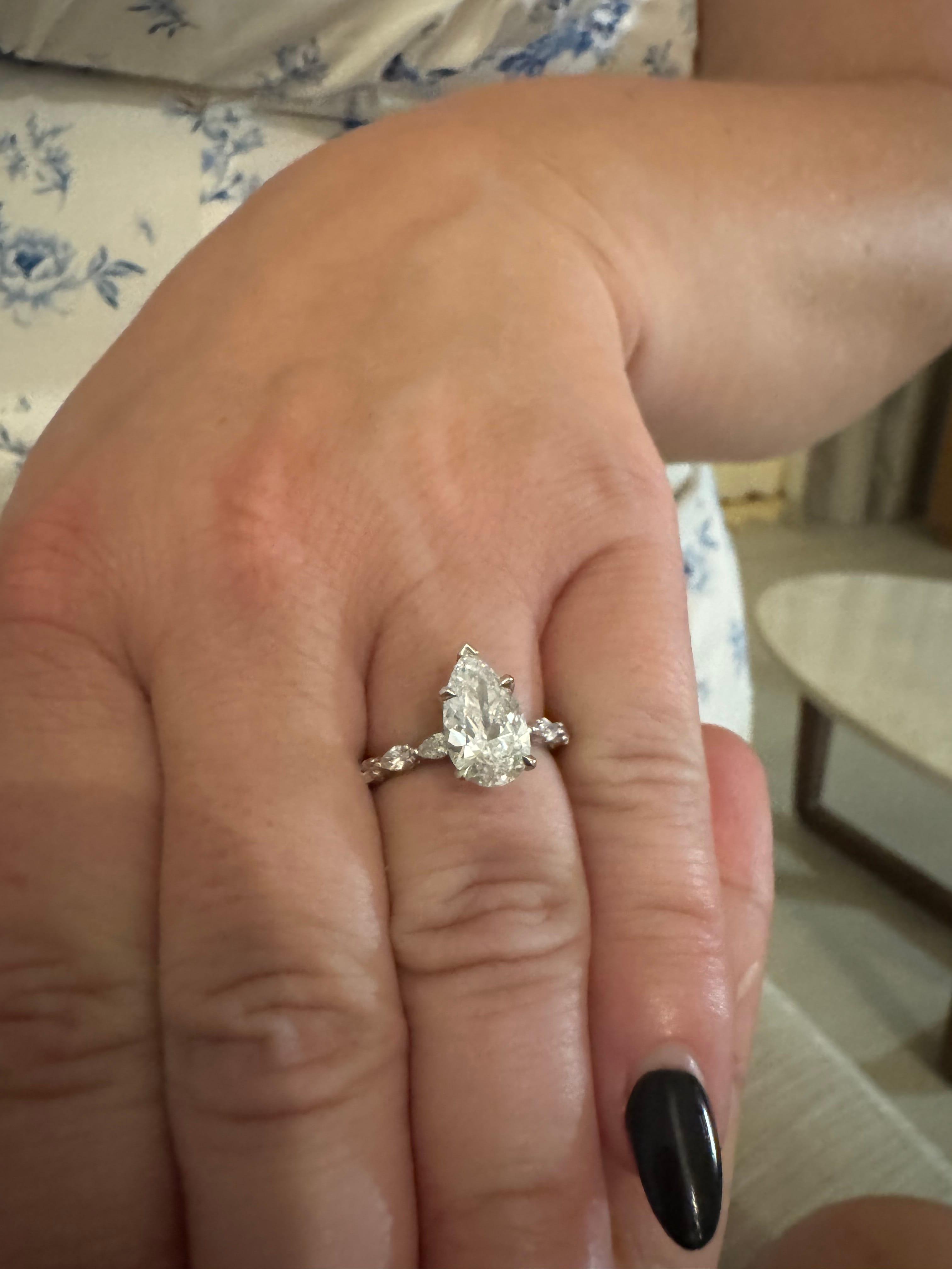 Oval diamond ring on hand