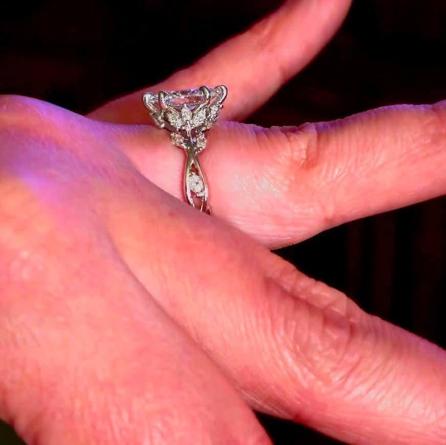 Oval diamond ring on hand