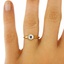 The Merrie Ring, smalltop view on a hand