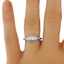The Starina Ring, smalltop view on a hand