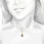 The Elva Pendant, smalltop view on a hand
