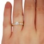 The Pia Engagement Ring, smallzoomed in top view on a hand