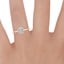 14K Rose Gold Secret Halo Diamond Ring, smallzoomed in top view on a hand