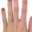 The Fredia Ring, smallzoomed in top view on a hand