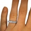 Mercy Wedding Ring, smallzoomed in top view on a hand