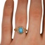 The Ulani Ring, smallzoomed in top view on a hand