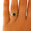 The Olive Ring, smalltop view on a hand