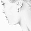 The Tryne Earrings, smalltop view on a hand