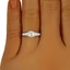The Emera Ring, smallzoomed in top view on a hand