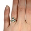 The Caprice Ring, smallzoomed in top view on a hand