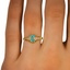 The Dilis Ring, smallzoomed in top view on a hand