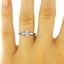 The Joanie Ring, smalltop view on a hand