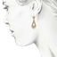 The Tarsha Earrings, smalltop view on a hand