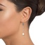 The Anitra Earrings, smalltop view on a hand