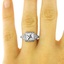 The Desirée Ring, smallzoomed in top view on a hand